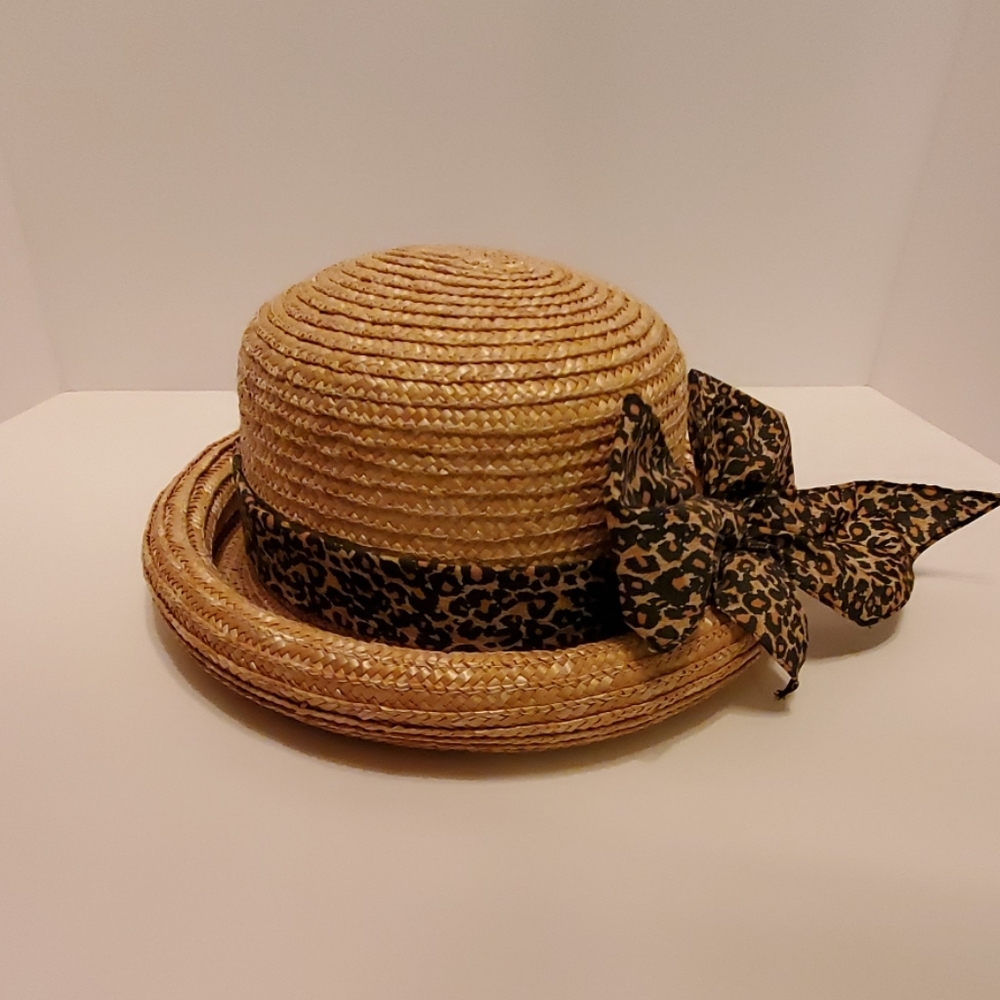 A rolled brim woven straw hat